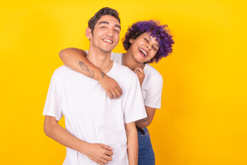 Wall Mural - happy young couple isolated on color background