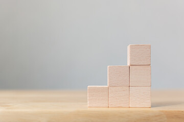 Wooden block stacking as step stair on top. Business concept for growth success process