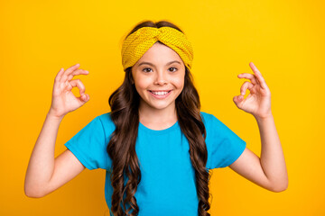 Portrait of positive kid girl little promoter show ok sign agree sales excellent adverts wear good look clothes isolated over shine color background