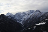 Fototapeta Góry - High dangerous mountains on a cold winter day.