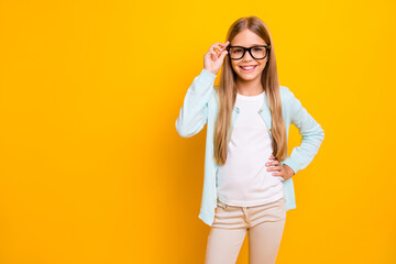 Canvas Print - Photo of beautiful pretty little blond lady diligent student pupil 1 september school girl ready start learn study year wear specs casual shirt pants isolated yellow bright color background