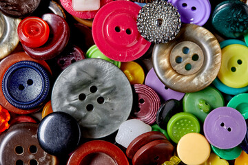 Fototapete - Background and texture of multicolored antique buttons