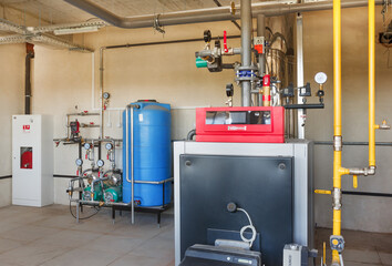 Wall Mural - interior of a modern gas boiler room, with a water treatment system, many valves and sensors