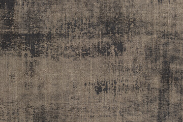 Rustic background with canvas texture with with spots of gray paint