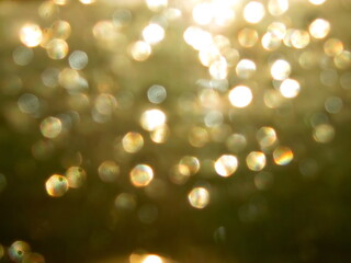 
Abstract golden background with bokeh in defocus