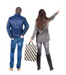 © ghoststone - back view of couple with shopping bags in winter jacket.