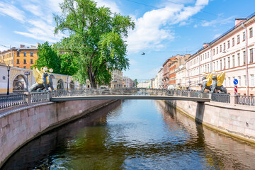 Bank bridge with golden-winged griffons over Griboyedov canal, Saint Petersburg, Russia