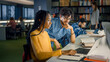 © Gorodenkoff - University Library: Gifted Black Girl uses Laptop, Smart Classmate Explains and Helps Her with Class Assignment. Happy Diverse Students Talking, Learning, Studying Together for Exams
