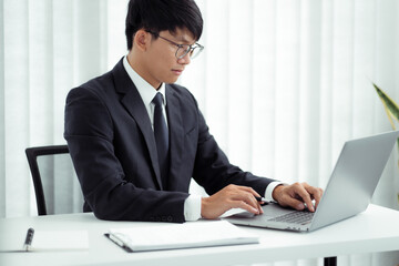 Wall Mural - Attractive asian smiling businessman in office place, Confident young man.