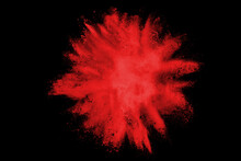 Red Powder Explosion Isolated On Black Background.