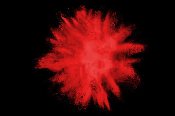 Wall Mural - red powder explosion isolated on black background.