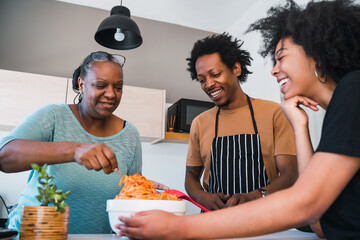 Wall Mural - Portrait of family cook together at home.