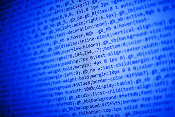 Poster - Program code on a monitor