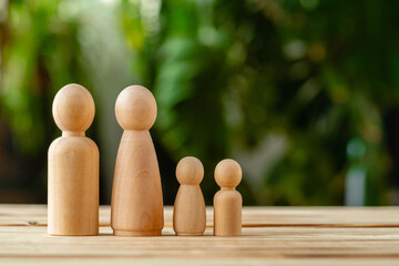 Wooden little figures of people. Family concept