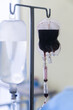 © thanarak - Spare blood bags from laboratory medical hanging on a steel pole at the hospital In order to prepare blood for the veins of the patients who want to donate blood in the same group