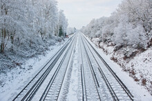Train Tracks In Frozen Winter Landscape In South England
