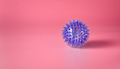 Spiky massage ball isolated on pink background