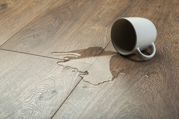 Wall Mural - Laminate background.. Wooden laminate and parquet board with spilled water. Moisture protection of a floor