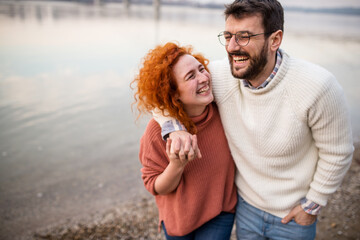 a young couple on a journey. walk by the river