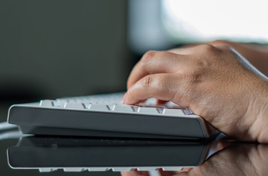hands of a woman on keyboard
