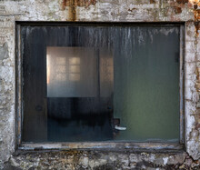 Fragment Of Weathered Stone Wall With Small Dirty Window Of Derelict Industrial Building