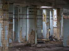 Concrete Walls And Remains Of Stairways In Old Abandoned Industrial Building With Messy Ground
