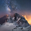 © Juan Lopez/ADDICTIVE STOCK - Amazing view of white snowy mountain range under incredible night starry sky with breaking rays of rising sun from behind mountains in winter evening