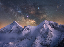 Scenic View Of Snowcapped Mountains Against Starry Sky