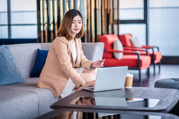 Team work process. Two women with laptop in open space office. Business concept., two women is meeting for business matching. ,Two young beautiful asian business woman in the conversation.