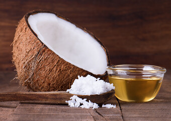 Coconut and coconut oil on wooden background