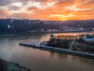 Colorful Sunrise burning sky Koblenz City historic monument German Corner where river rhine and mosele flow together