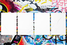 Closeup Of Colorful Messy Painted Urban Wall Texture With Four Wrinkled Glued Poster Templates. Modern Mockup For Design Presentation With Clipping Path. Creative Urban City Background.