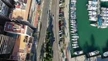 Car driving through the city of Palma (Mallroca). Drone follow shot. GTA style.