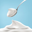 Natural greek yogurt in the spoon on blue background realistic illustration.