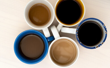 Many cups of coffee on table flat lay copy space.