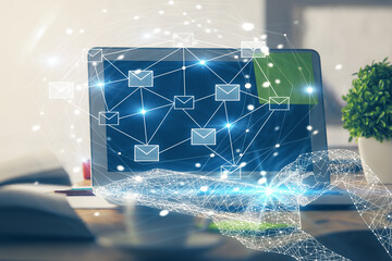 Desktop computer background in office and flying envelops hologram drawing. Multi exposure. Electronic mail concept.
