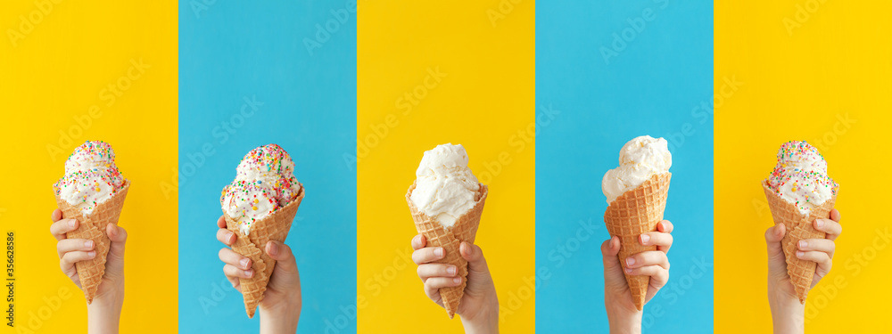 Child holding a vanilla ice cream cone on a bright yellow and blue ...