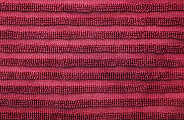 Wall Mural - Dark burgundy red cotton terry towel. Soft fabric background of bath towel close up view with loops of thread. Classic simple home decor item for bathroom ans shower