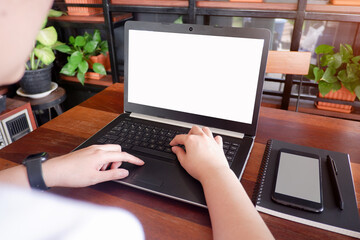 Fototapete - Cropped shot view of business woman’s hands typing the labtop with blank copy space screen for your information content or text message.