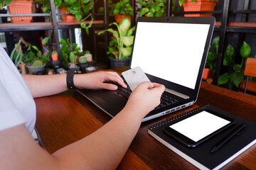 Fototapete - Cropped shot view of business woman’s hands typing the labtop with blank copy space screen for your information content or text message.