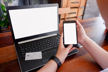 Fototapete - Cropped shot view of business woman’s hands typing the labtop with blank copy space screen for your information content or text message.