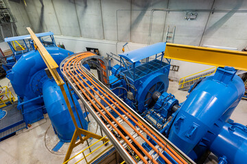 Looking down at two turbine units in a power plant