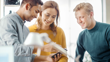 Aufkleber - Three Start-up Entrepreneurs Have Meeting and Discussion about Project, They Discuss Project Design, Share Touch Screen Digital Tablet Screens. Modern Stylish Office with Diverse Team of Professionals