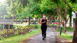 © khamkula - Portrait of Asia woman wearing mask jogging in the park