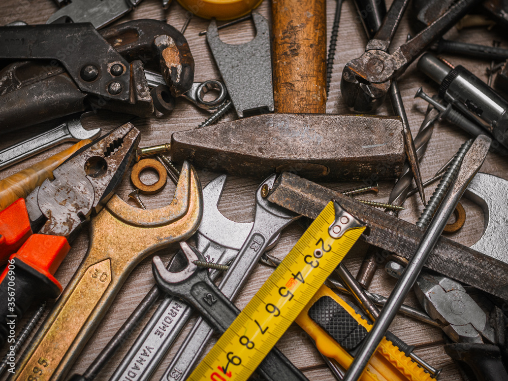 Building and measuring tools. Set of tools over a wood panel ...