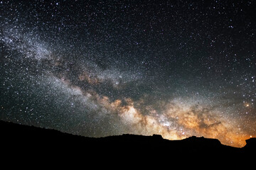 Wall Mural - Beautiful starry sky with bright milky way galaxy. Night landscape. Astronomical background.
