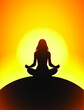 silhouette of a woman meditating in yoga pose with sun disk in the background