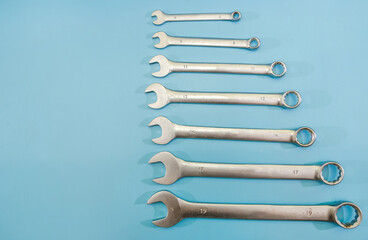 wrenches on a blue background. Copy of space. Place for the inscription.