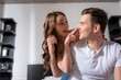 © LIGHTFIELD STUDIOS - excited girl touching nose of happy boyfriend