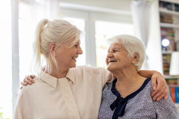 Wall Mural - Woman spending time with her elderly mother

